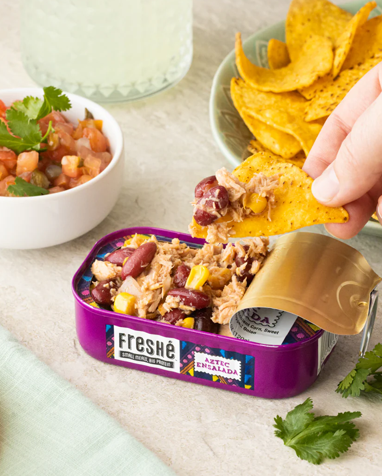 Open tin of Aztec Ensalada with tortilla chips
